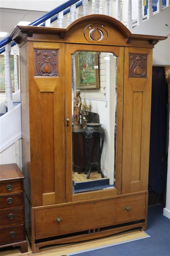 An Art Nouveau walnut wardrobe W.142cm